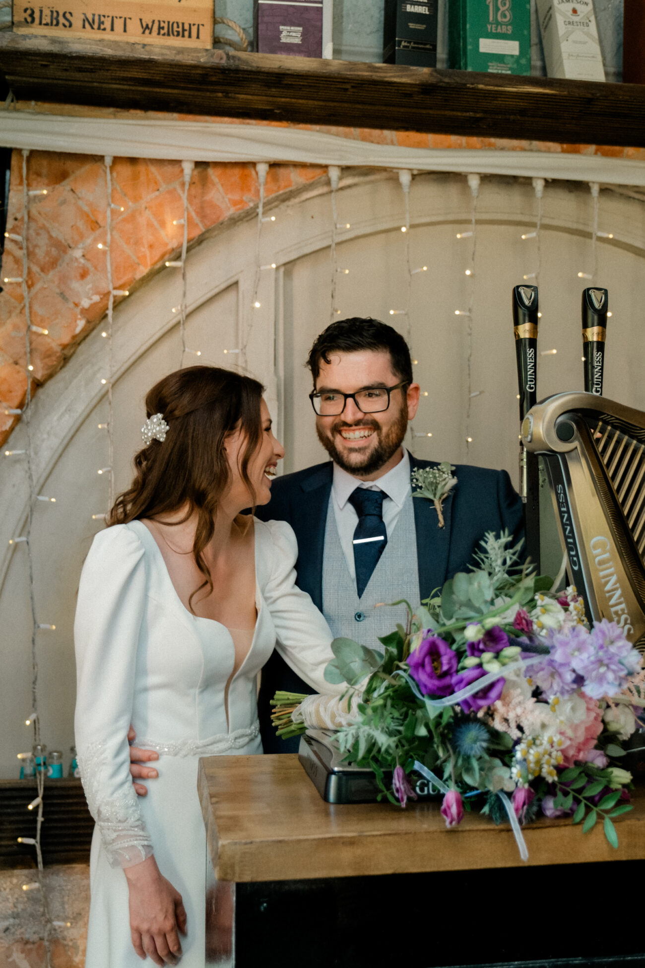 Bride and groom at the snug pub at Portmarnock Resort, Wedding portrait locations at Portmarnock Resort