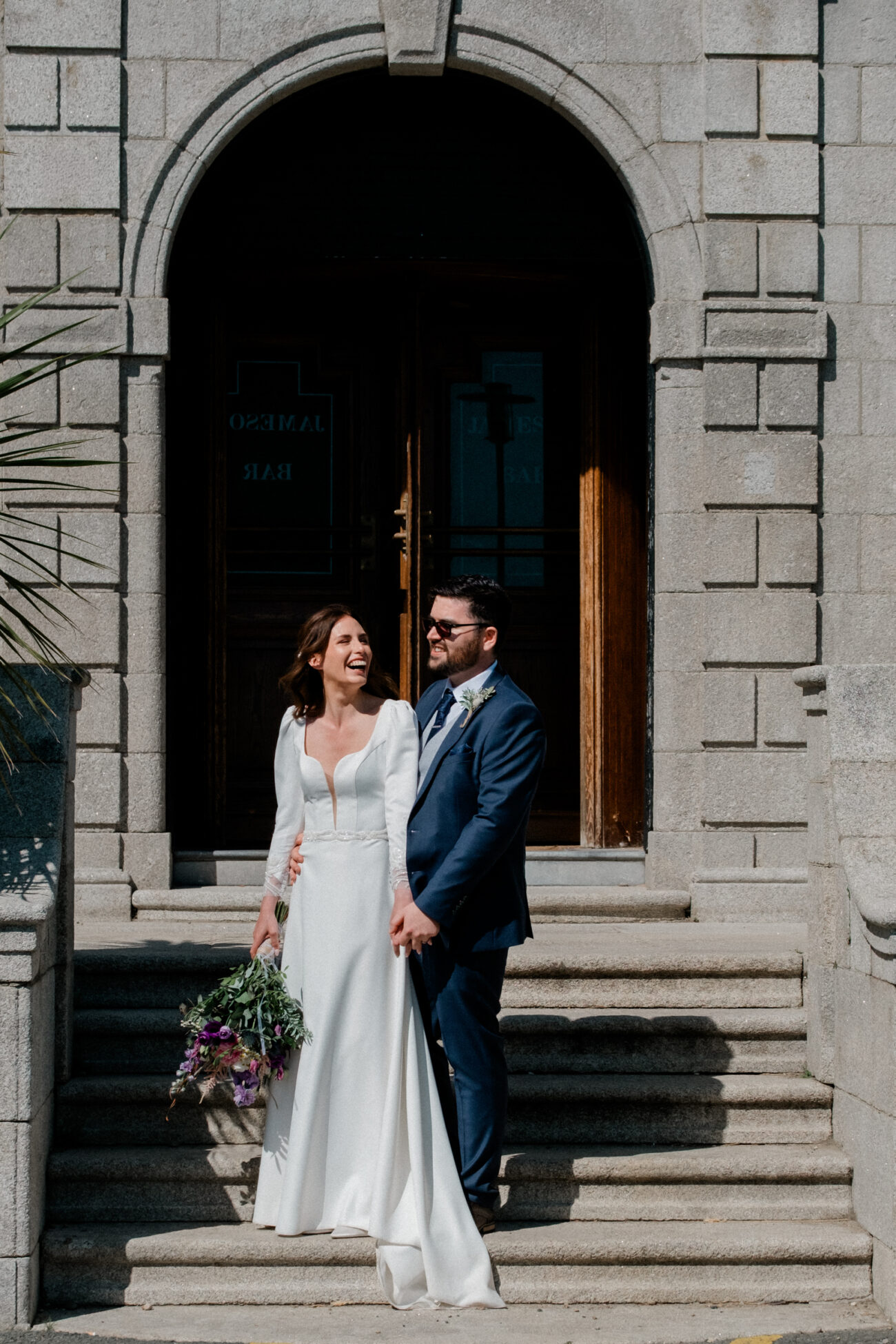 Couple standing at the front of the old building of Portmarnock Resort