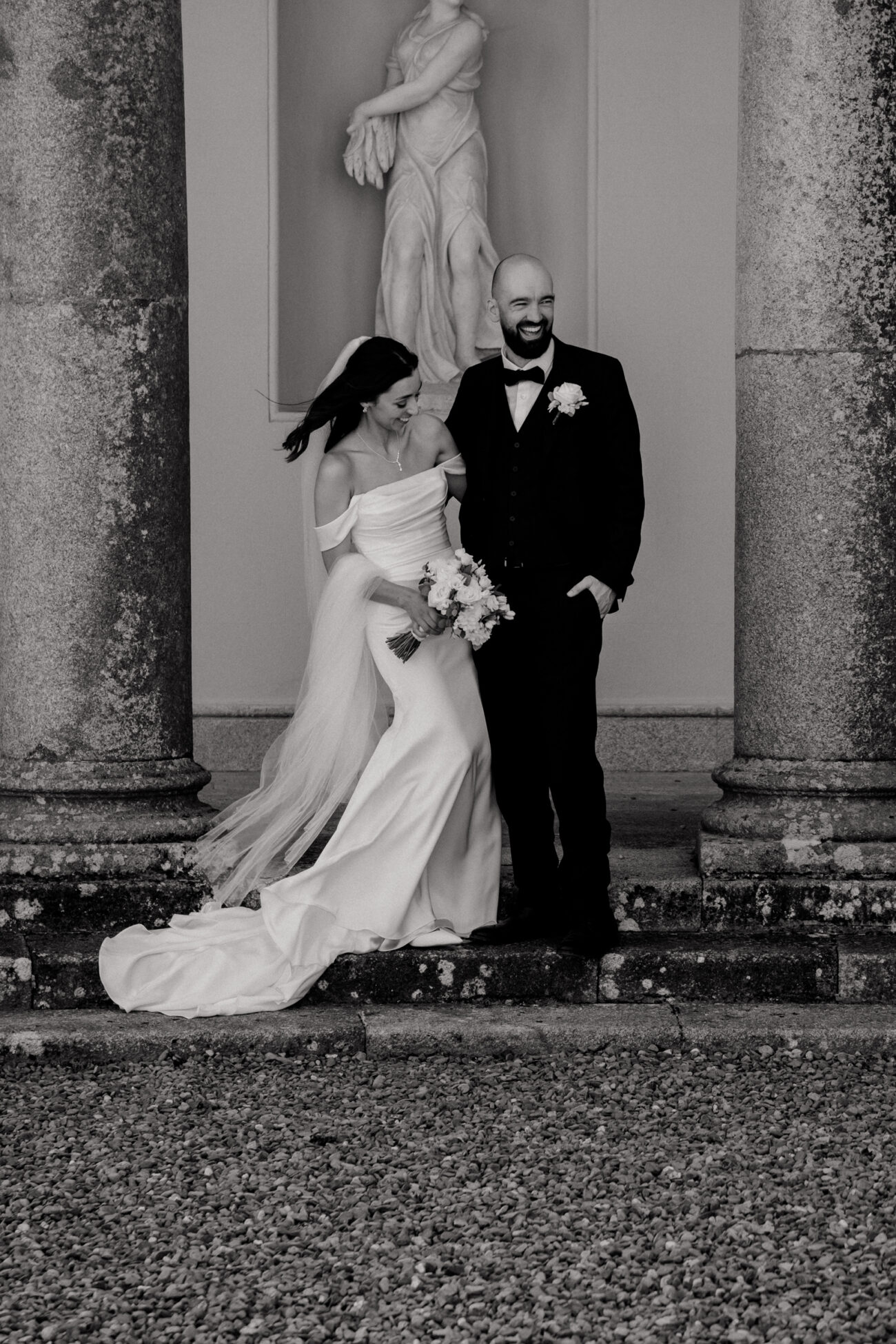 bride and groom laughing together during wedding portraits at Russborough House