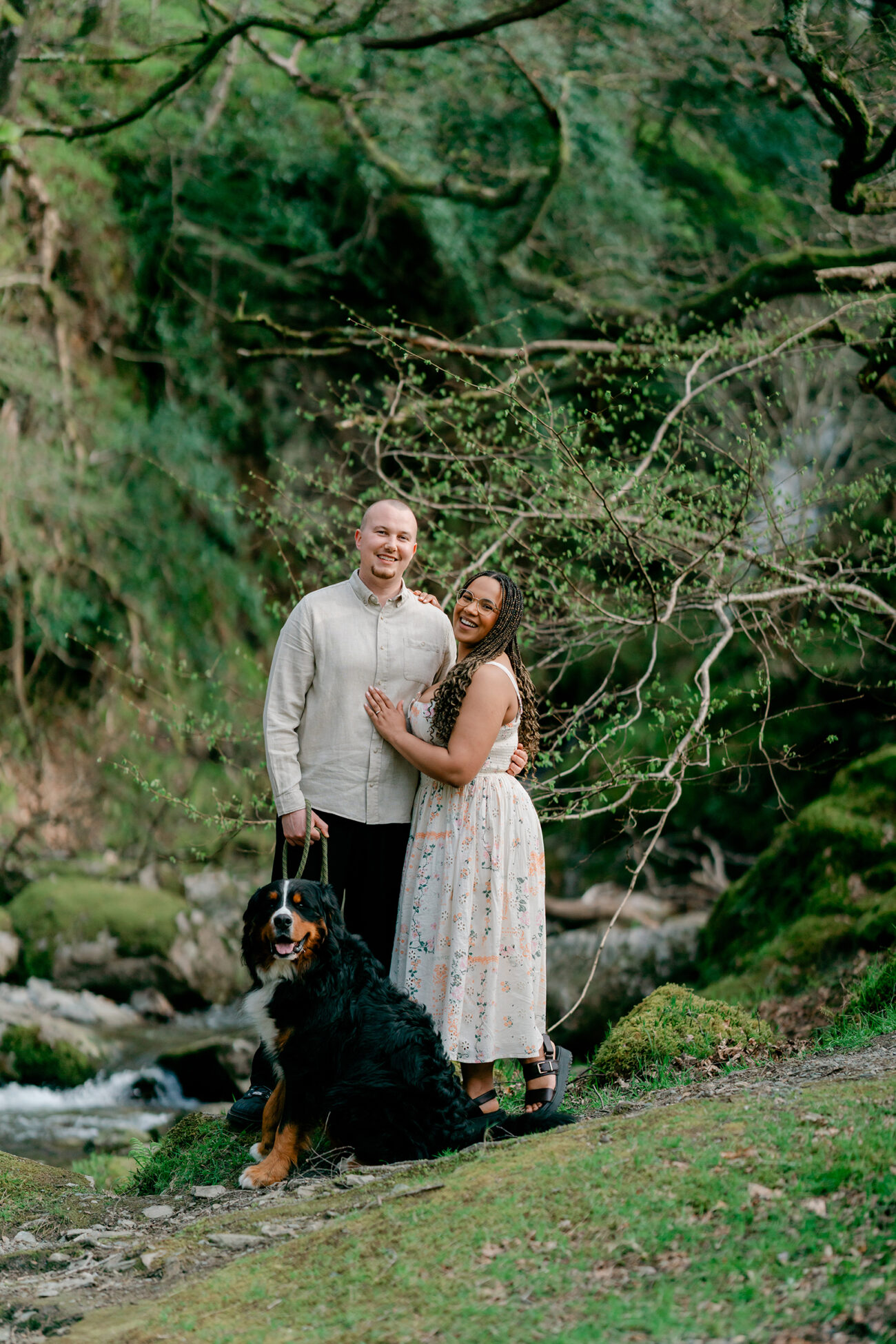 Couple in Glendalough waterfall for an engagement shoot with their dog